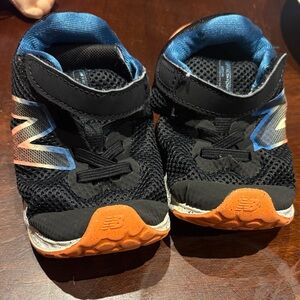 New Balance Kids' Black and Blue Sneakers with Orange Accents